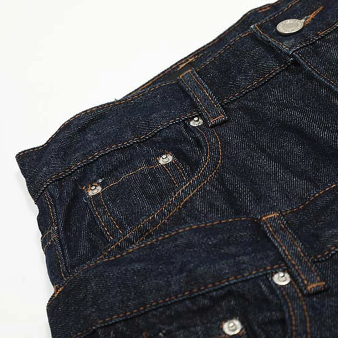 Flared jeans with distressed tassels